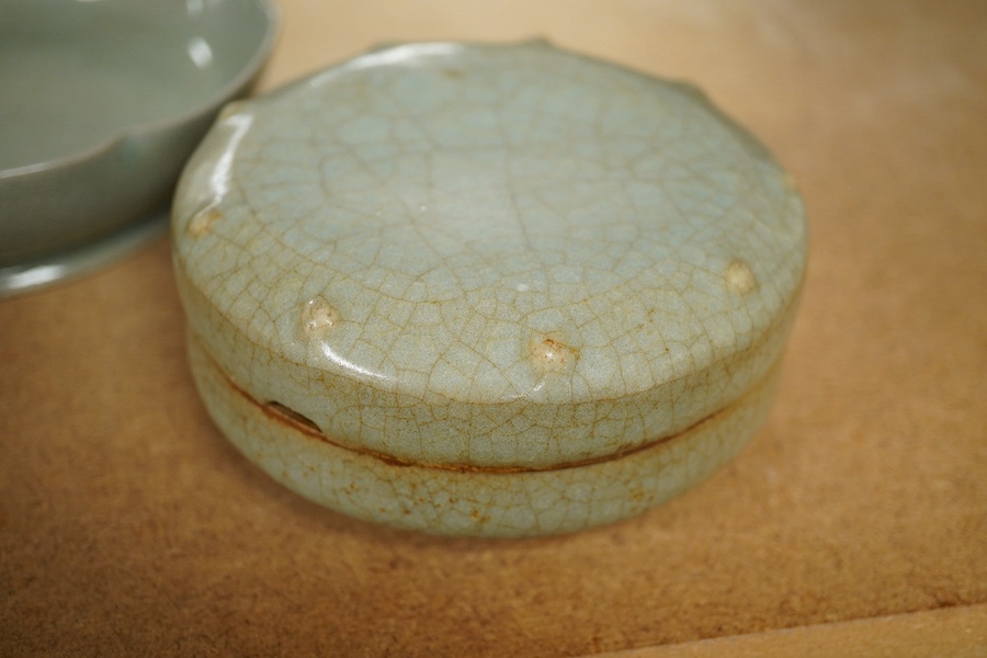 A Chinese celadon glazed box and cover and two similar bowls, largest 15cm diameter. Condition - varies